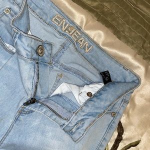 Flare ripped denim jeans.